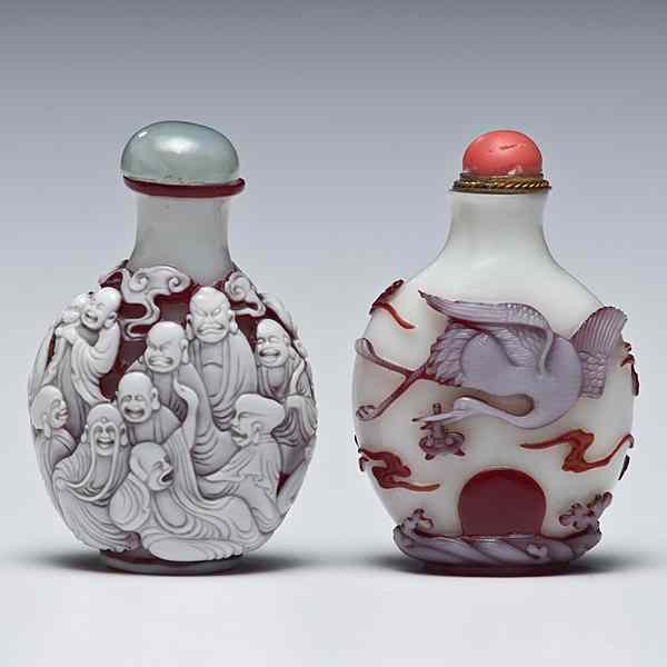 Appraisal: Peking Glass Snuff Bottles Chinese Two Peking glass snuff bottles