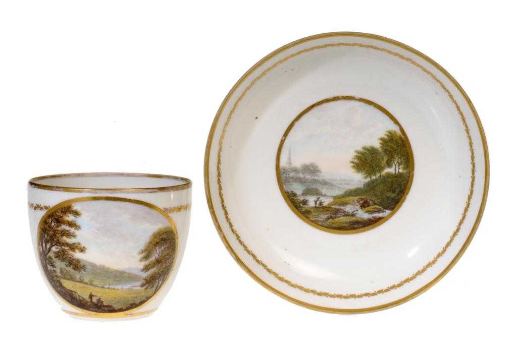 Appraisal: A DERBY TOPOGRAPHICAL TEACUP AND SAUCER of bute shape painted