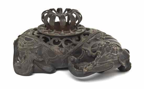 Appraisal: A Japanese Bronze Elephant Form Censer depicting the recumbent animal