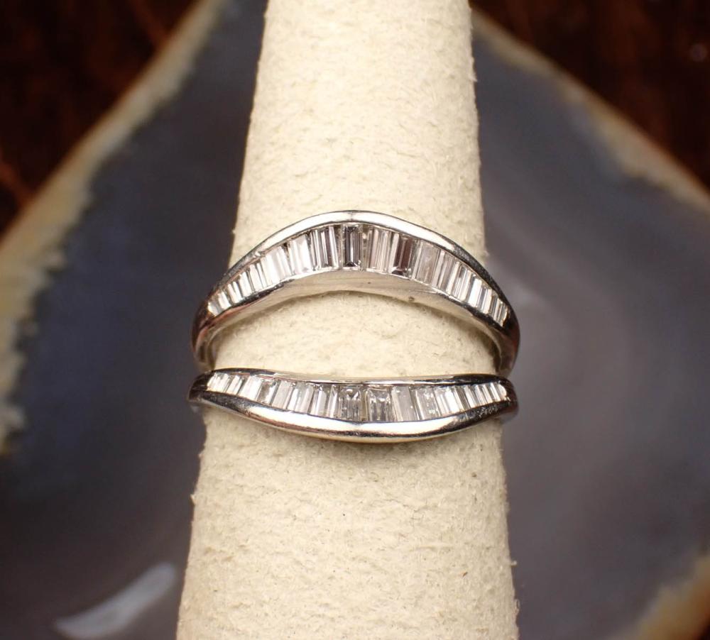 Appraisal: DIAMOND AND PLATINUM RING GUARD channel set with two rows