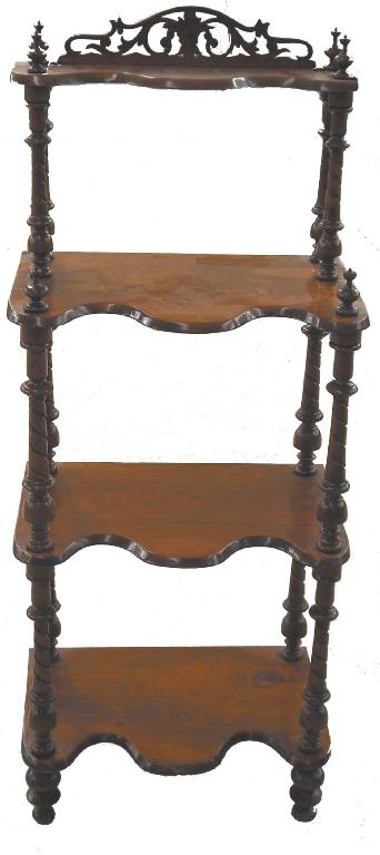 Appraisal: Victorian walnut four tier whatnot with a foliate pierced fret