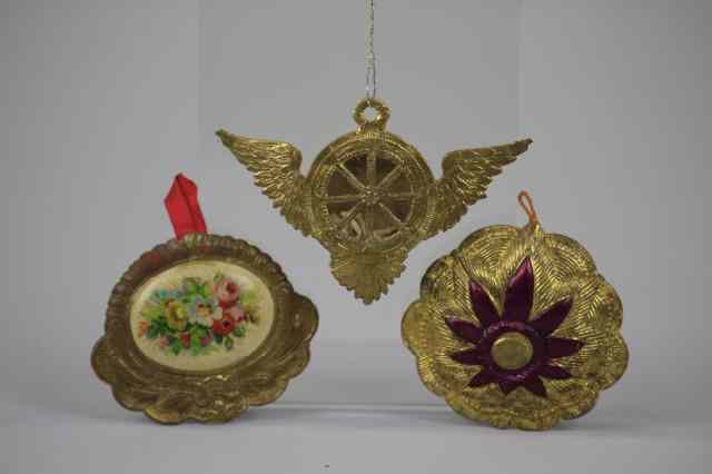 Appraisal: THREE EARLY DRESDEN ORNAMENTS Germany includes winged wheel medallion candy