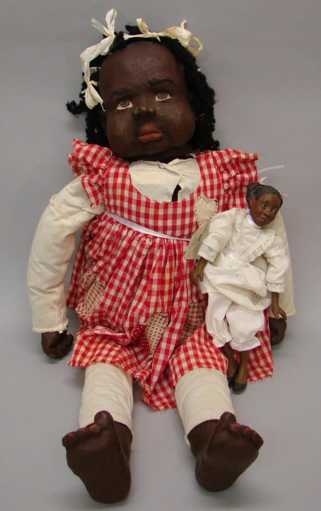 Appraisal: Pair of black dolls CRUNKLETON Chile - - on pocket