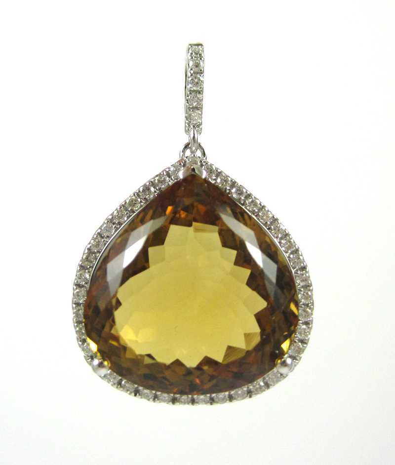 Appraisal: CITRINE DIAMOND AND FOURTEEN KARAT GOLD PENDANT The white gold