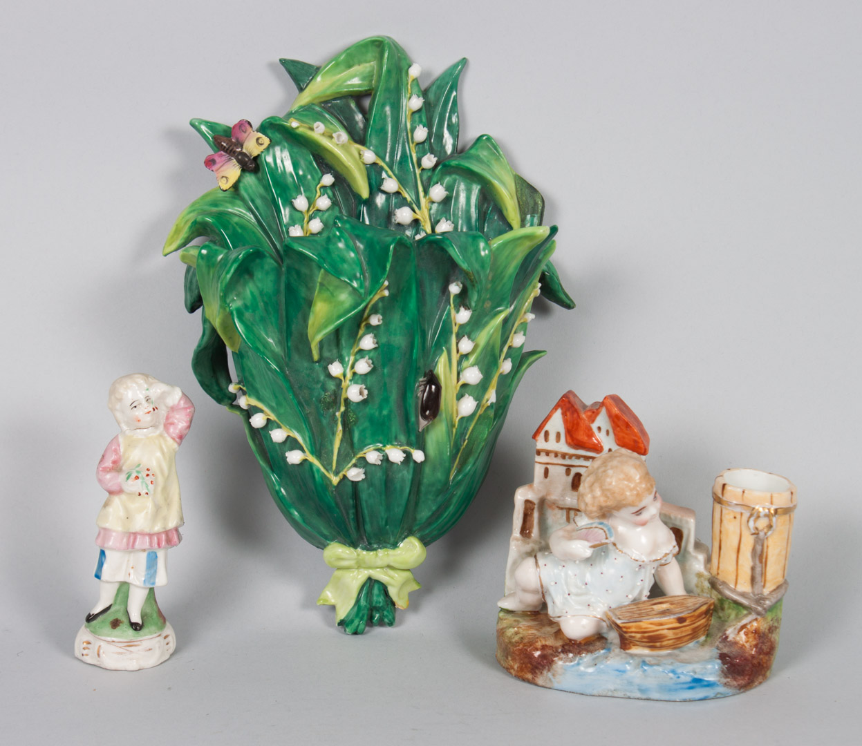 Appraisal: Three German porcelain objects late th century including figural spill