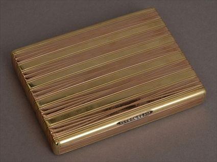 Appraisal: CONTINENTAL TWO-COLOR GOLD CIGARETTE BOX Impressed CE within a square