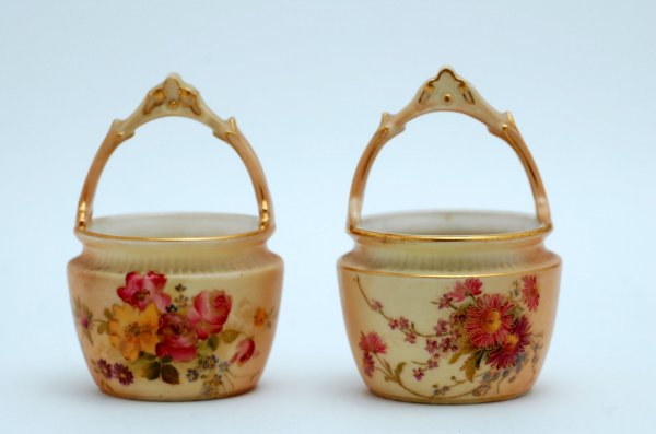 Appraisal: Two Royal Worcester handled baskets both having floral decoration on