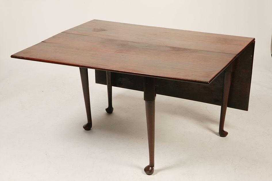 Appraisal: A GEORGE III YEW WOOD DROP FLAP DINING TABLE the