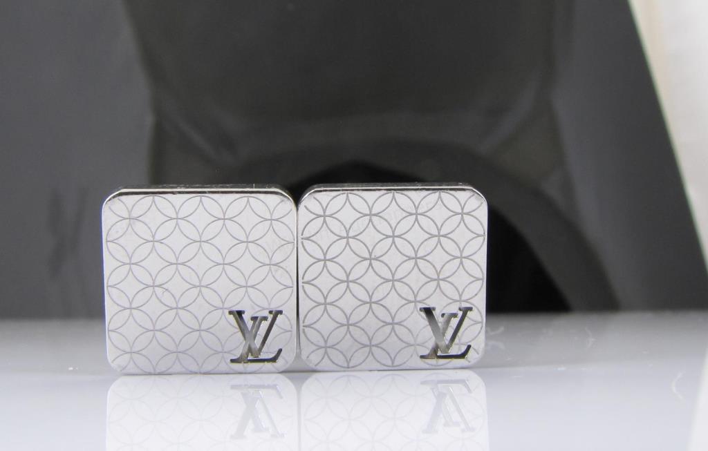 Appraisal: A pair of signed patterned Louis Vuitton cufflinks made in