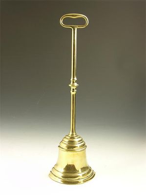 Appraisal: A Victorian brass door stop of bell shape weighted with