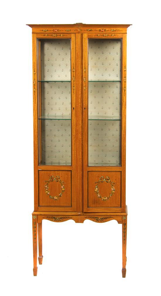 Appraisal: n Edwardian Satinwood Vitrine Cabinet the rectangular top over two