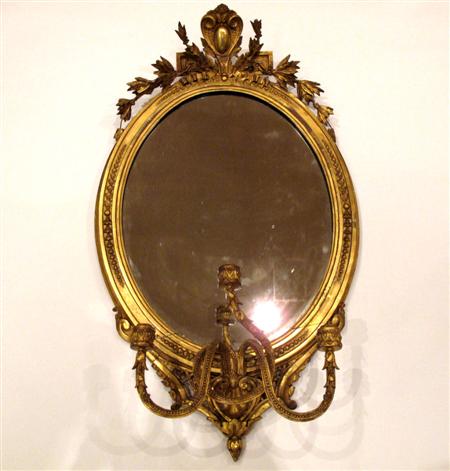 Appraisal: A Victorian giltwood and gesso girandole wall mirror the oval