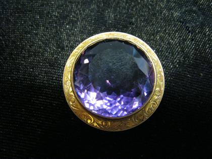 Appraisal: Low karat yellow gold amethyst broochLarge mix cut circular amethyst