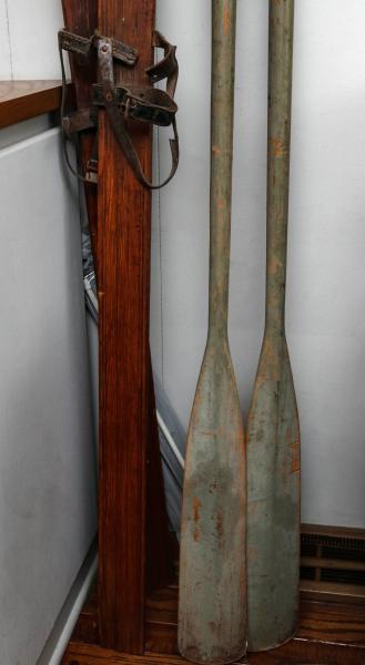 Appraisal: WOOD SKI PAIR AND BOAT OARS IN OLD GREEN PAINTONSITE