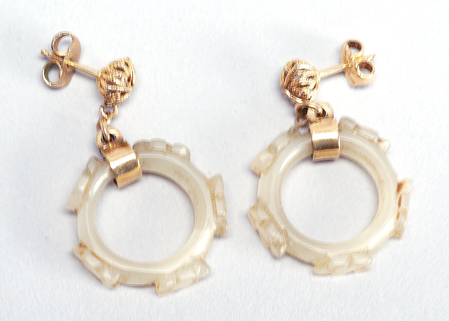 Appraisal: PAIR OF KT GOLD AND WHITE JADE EARRINGS In circular