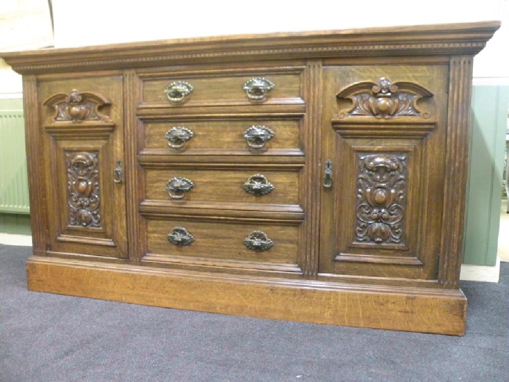 Appraisal: A late Victorian oak sideboard with an arrangement of three