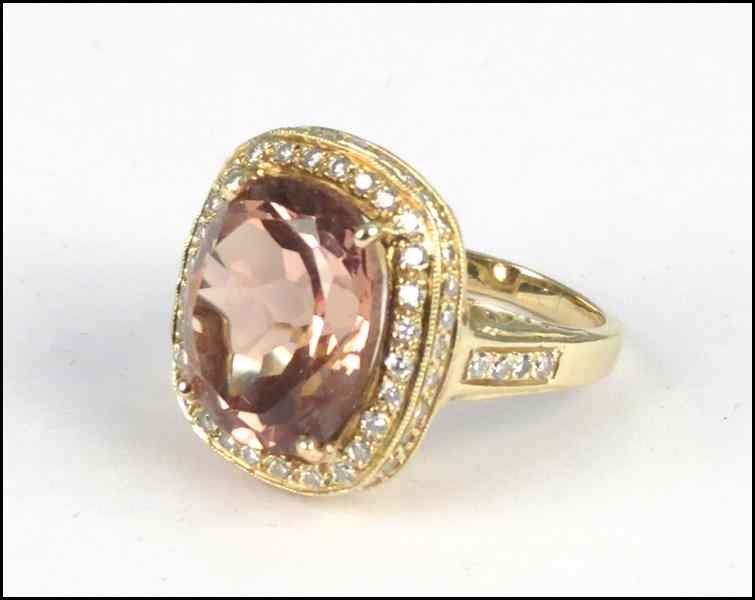 Appraisal: KARAT YELLOW GOLD SALMON TOURMALINE AND DIAMOND RING Tourmaline is