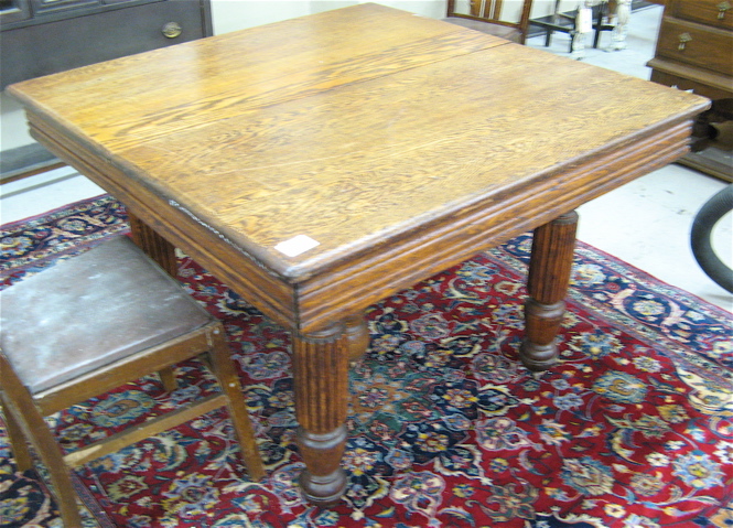 Appraisal: AN ANTIQUE SQUARE OAK DINING TABLE American c The square