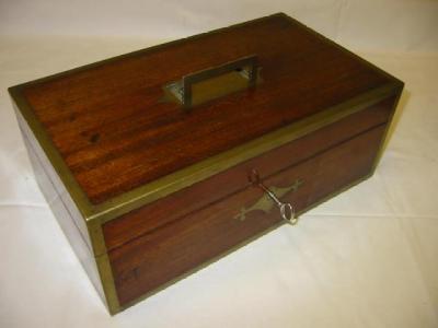 Appraisal: A MAHOGANY AND BRASS BOUND JEWEL BOX of oblong form