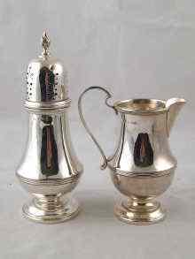 Appraisal: A silver cream jug and caster in original case Birmingham