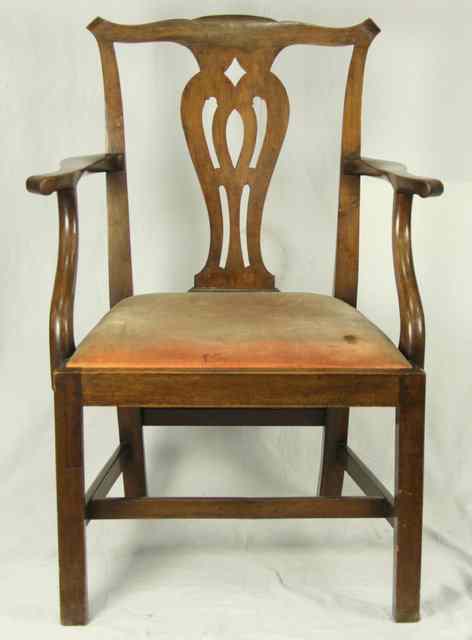 Appraisal: An th Century mahogany chair with pierced splat and upholstered