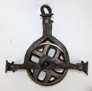 Appraisal: French bronze iron industrial pulley Antique French polished bronze iron