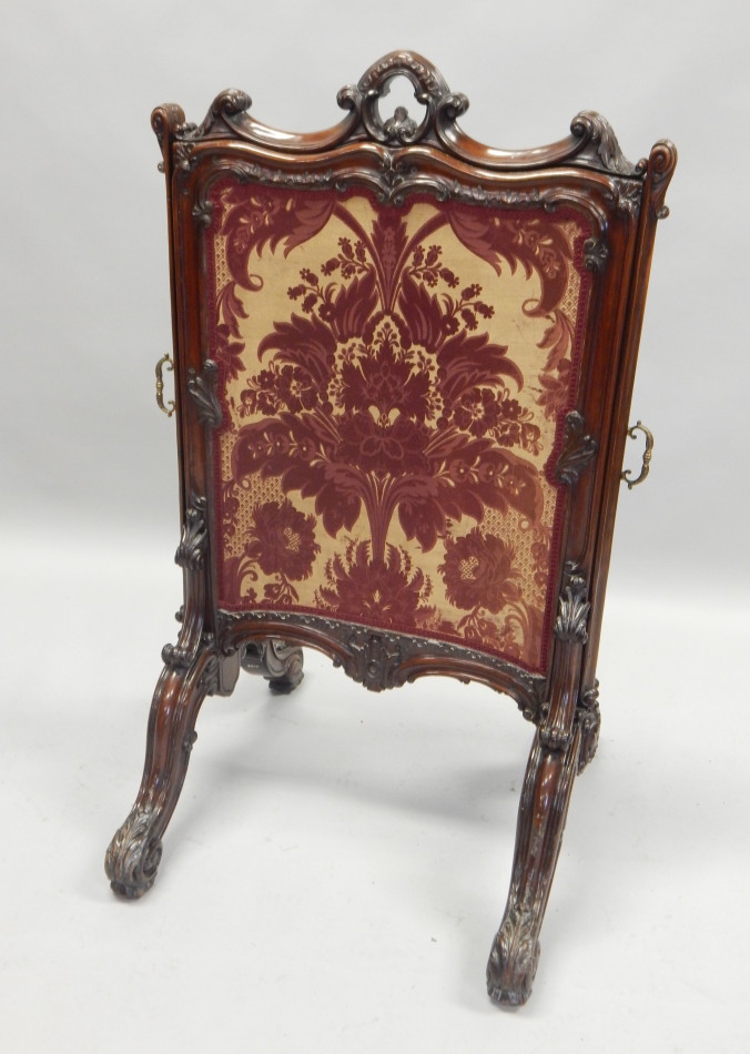 Appraisal: A Victorian rosewood firescreen with three pull out sections upholstered