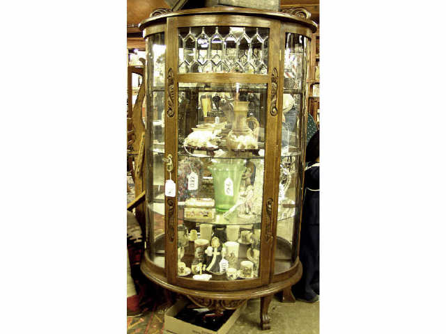 Appraisal: Oak leaded and curved glass china cabinet with three shelves