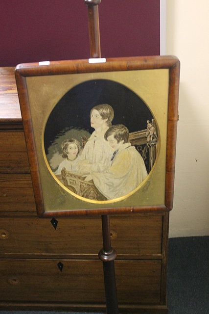 Appraisal: A VICTORIAN MAHOGANY POLE SCREEN the panel with woolwork scene