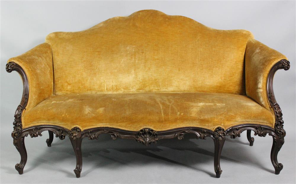 Appraisal: GEORGE III STYLE CARVED MAHOGANY AND UPHOLSTERED SOFA late th