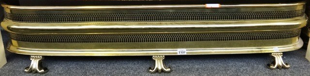 Appraisal: A Victorian brass fender with two tier pierced frieze and