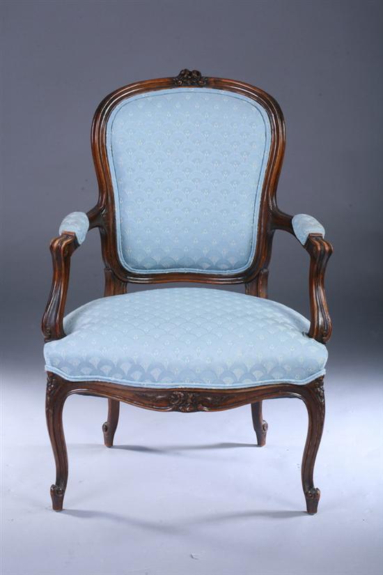 Appraisal: LOUIS XV STYLE CARVED FRUITWOOD FAUTEUIL th century century with