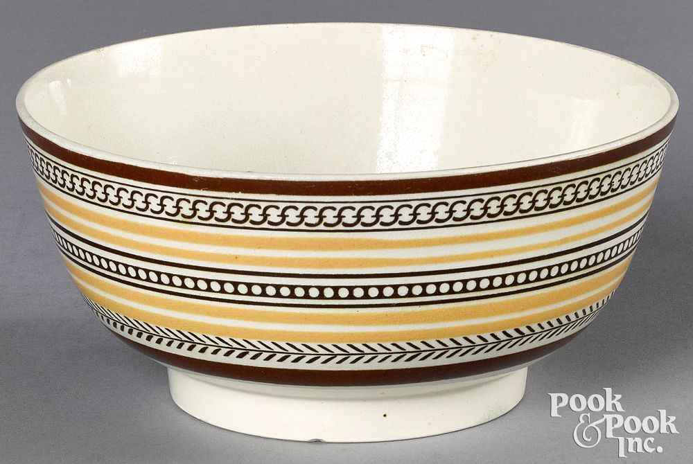 Appraisal: Mocha bowl with geometric and yellow bands Mocha bowl with