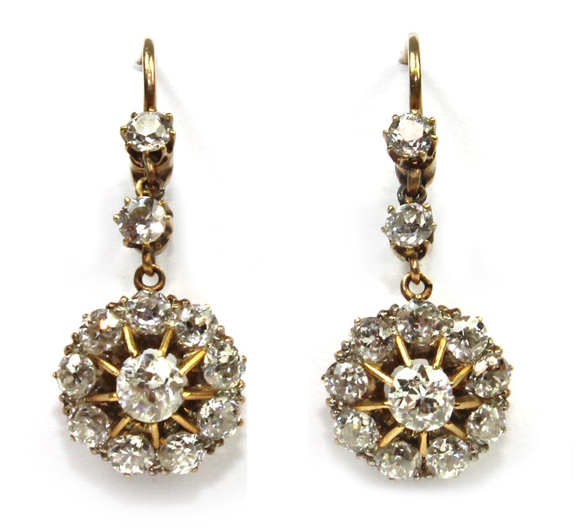 Appraisal: A pair of diamond set cluster earrings each claw set