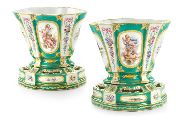 Appraisal: A pair of S vres style porcelain flower vases and