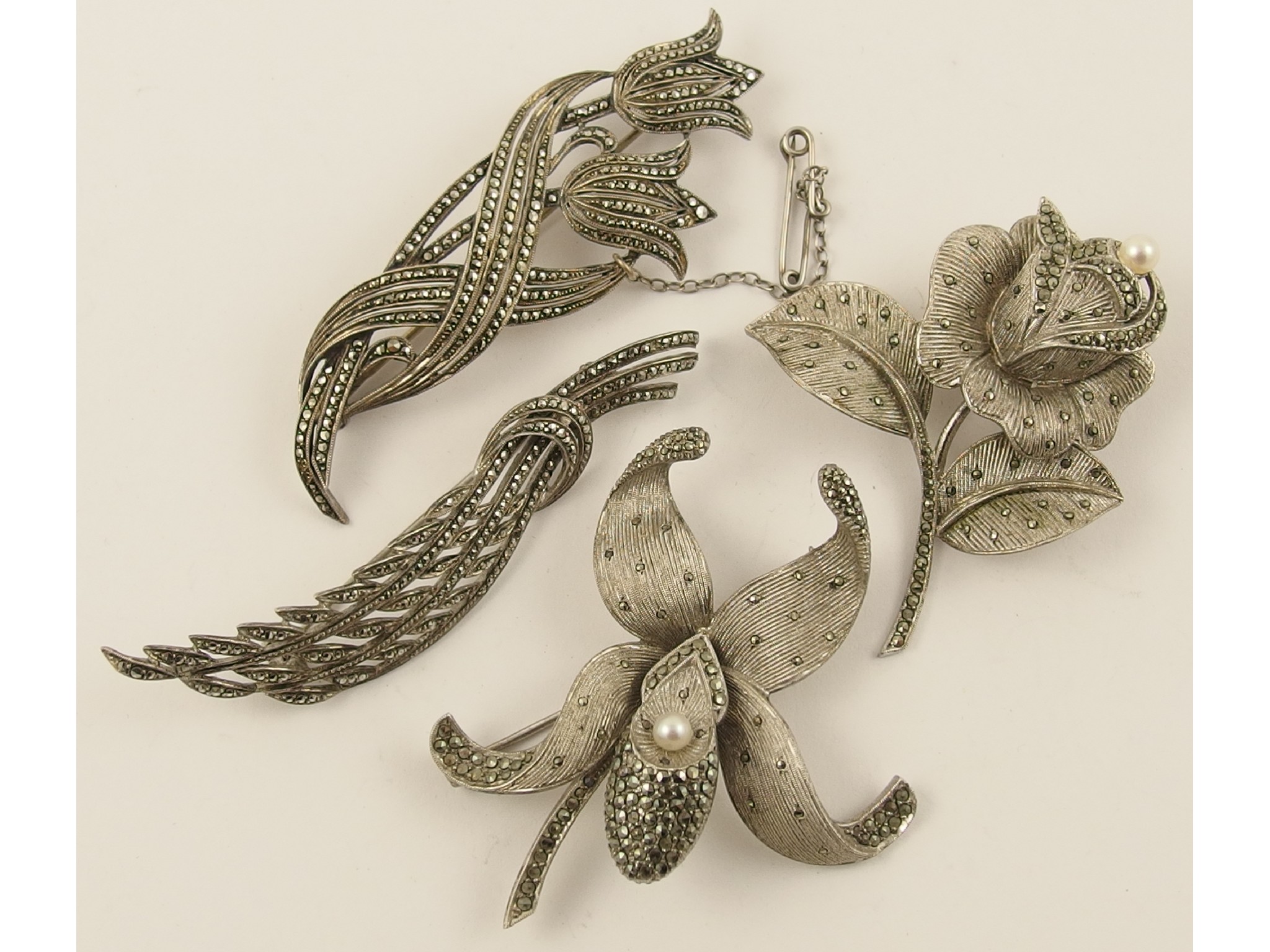 Appraisal: Four silver and marcasite brooches by Theodore Fahrner