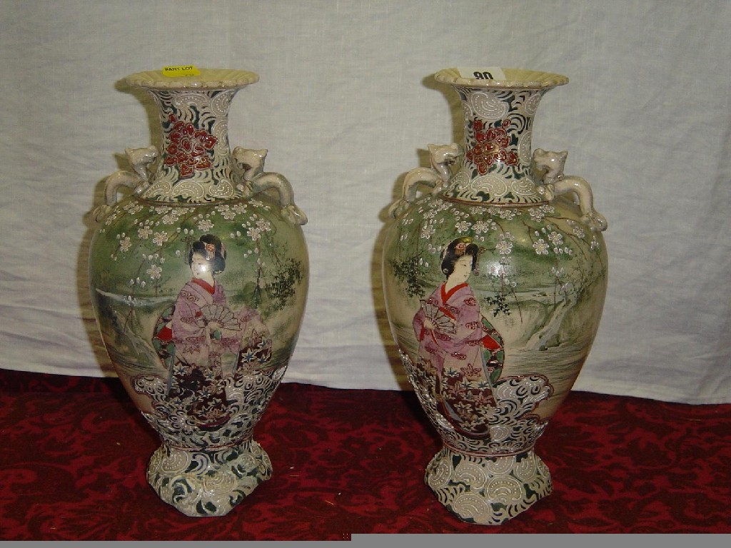 Appraisal: A pair of late th century Satsuma -handled vases with