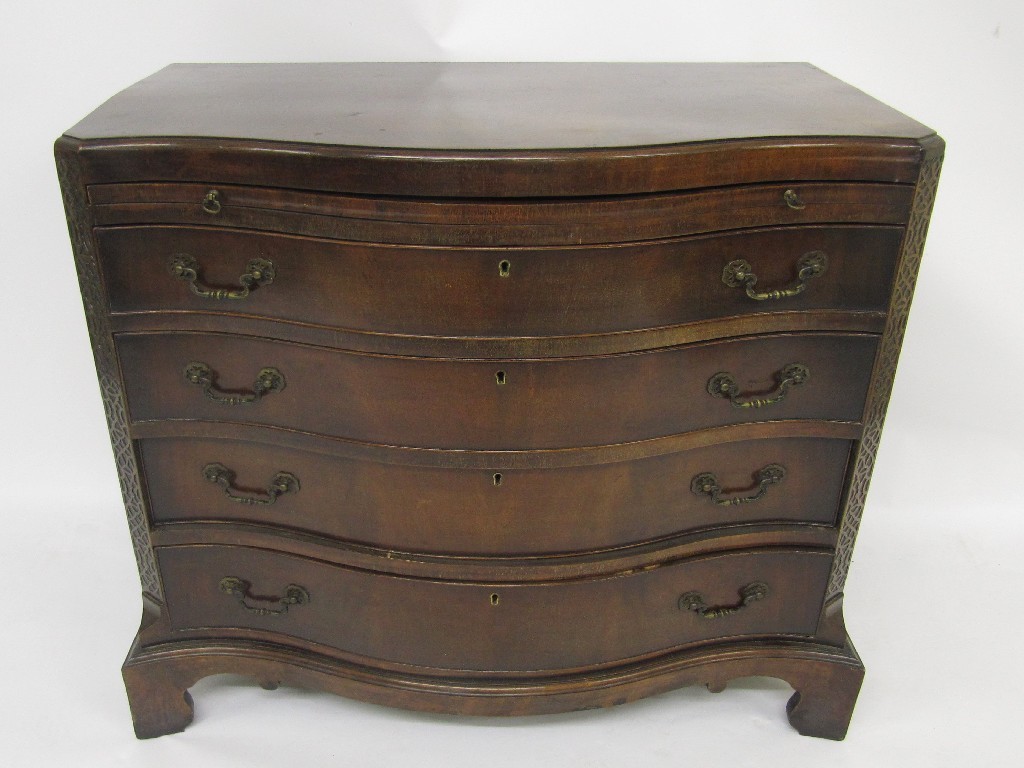 Appraisal: A reproduction mahogany serpentine chest of drawers the Georgian style