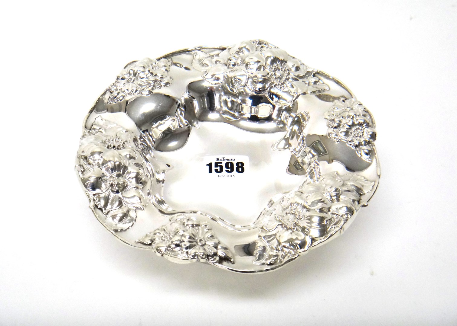 Appraisal: A silver pedestal dish of shaped circular form embossed with