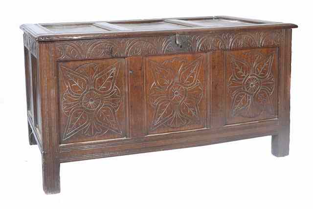 Appraisal: AN ANTIQUE OAK COFFER with chip carved decoration to the