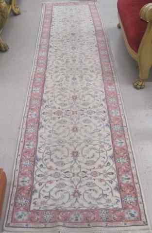 Appraisal: HAND KNOTTED ORIENTAL LONG RUG Indo-Persian overall pastel floral design