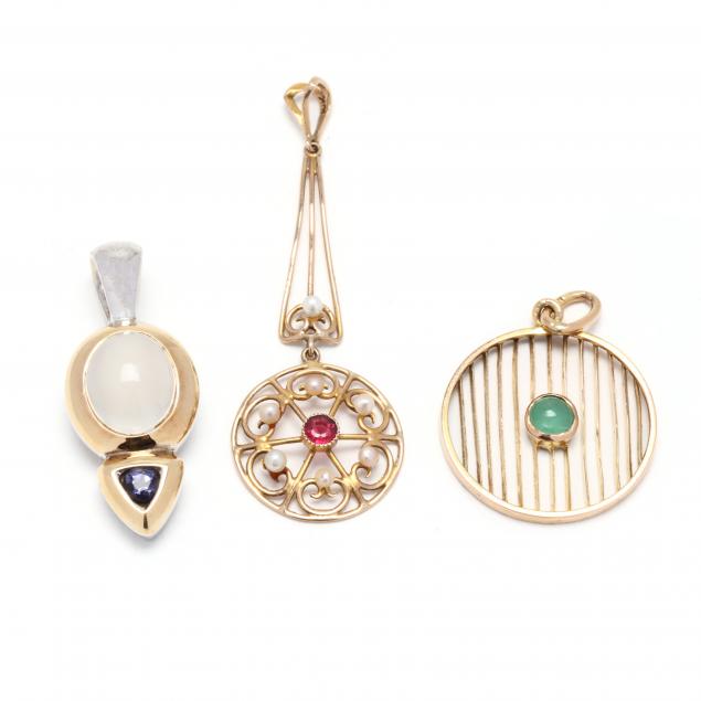 Appraisal: THREE GOLD AND GEM-SET PENDANTS To include a circle pendant