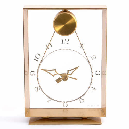 Appraisal: JEFFERSON Table-top clock with suspended lucite movement within brass-washed metal