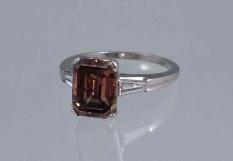 Appraisal: PLATINUM CT SOLITAIRE COGNAC DIAMOND RING WITH NEAR COLORLESS BAGUETTES