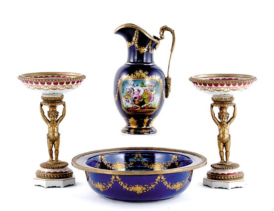 Appraisal: Pair porcelain and gilt-metal tazzas ewer and basin basin held