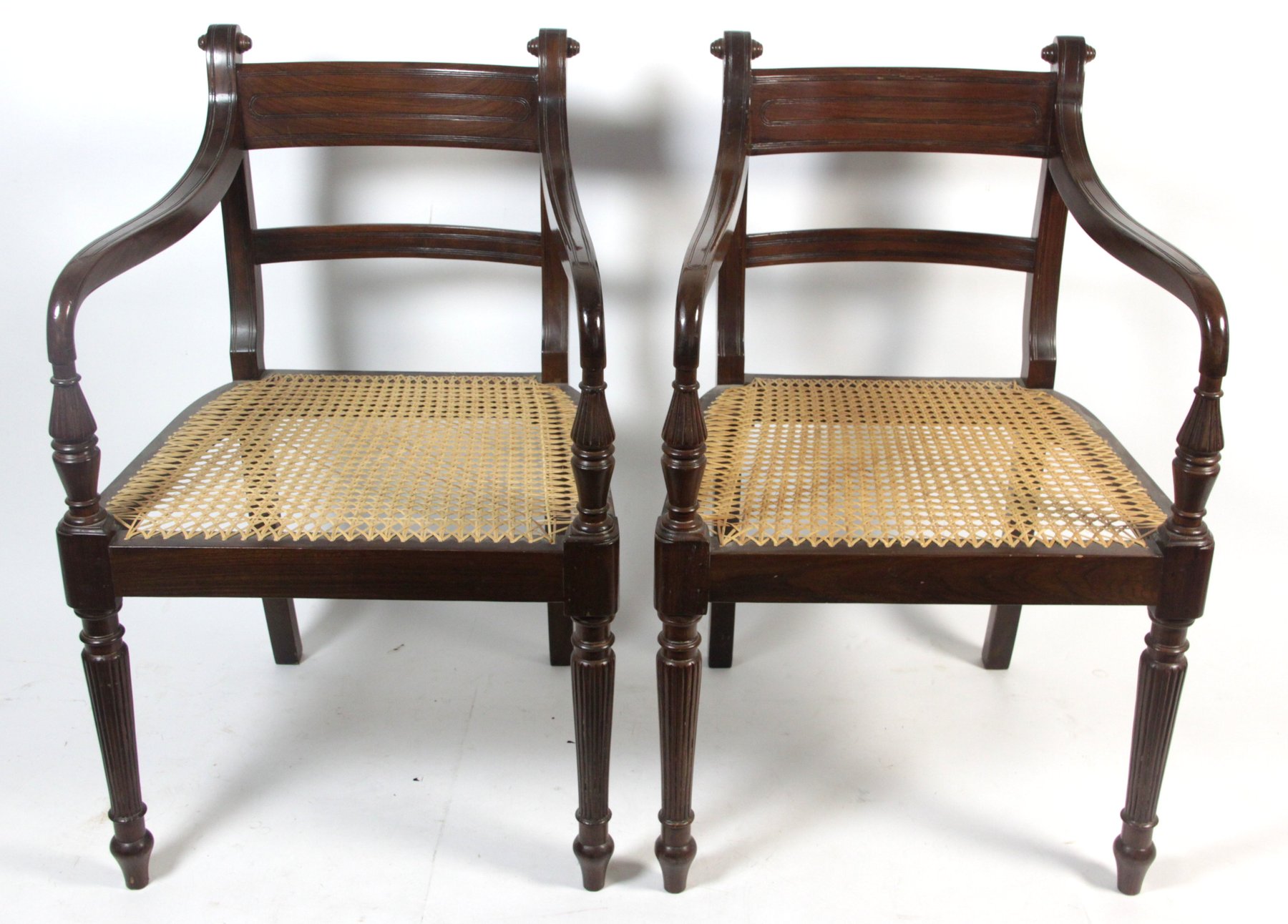 Appraisal: A pair of Regency style open armchairs the downswept arms