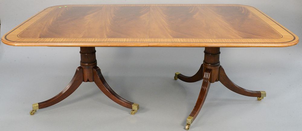 Appraisal: Baker Furniture mahogany double pedestal dining table having wide banded