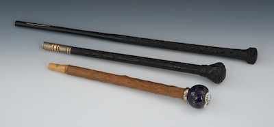 Appraisal: Three Wood Parasol Handles Two dark wood carved handles with