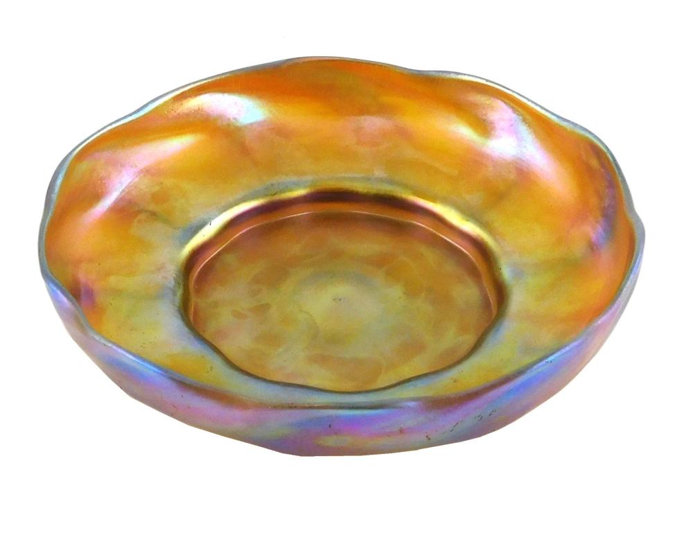 Appraisal: Louis Comfort Tiffany gold Favrile iridescent bowl c undulating rim