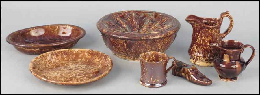 Appraisal: COLLECTION OF BENNINGTON STYLE POTTERY Comprised of plates pitchers and